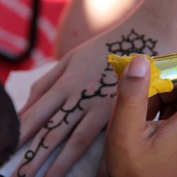 providing the cultural practice of henna for free to festival goers was also a passive form of dawah.