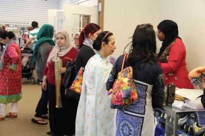 showroom crowded with Muslim women shopping.