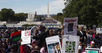People attending the Justice or Else rally on October 10th, 2015 display signs of their loved ones who have been killed through police brutality within the last few years.